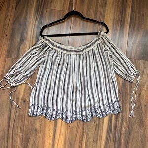 Black and cream/white eyelet off the shoulder top